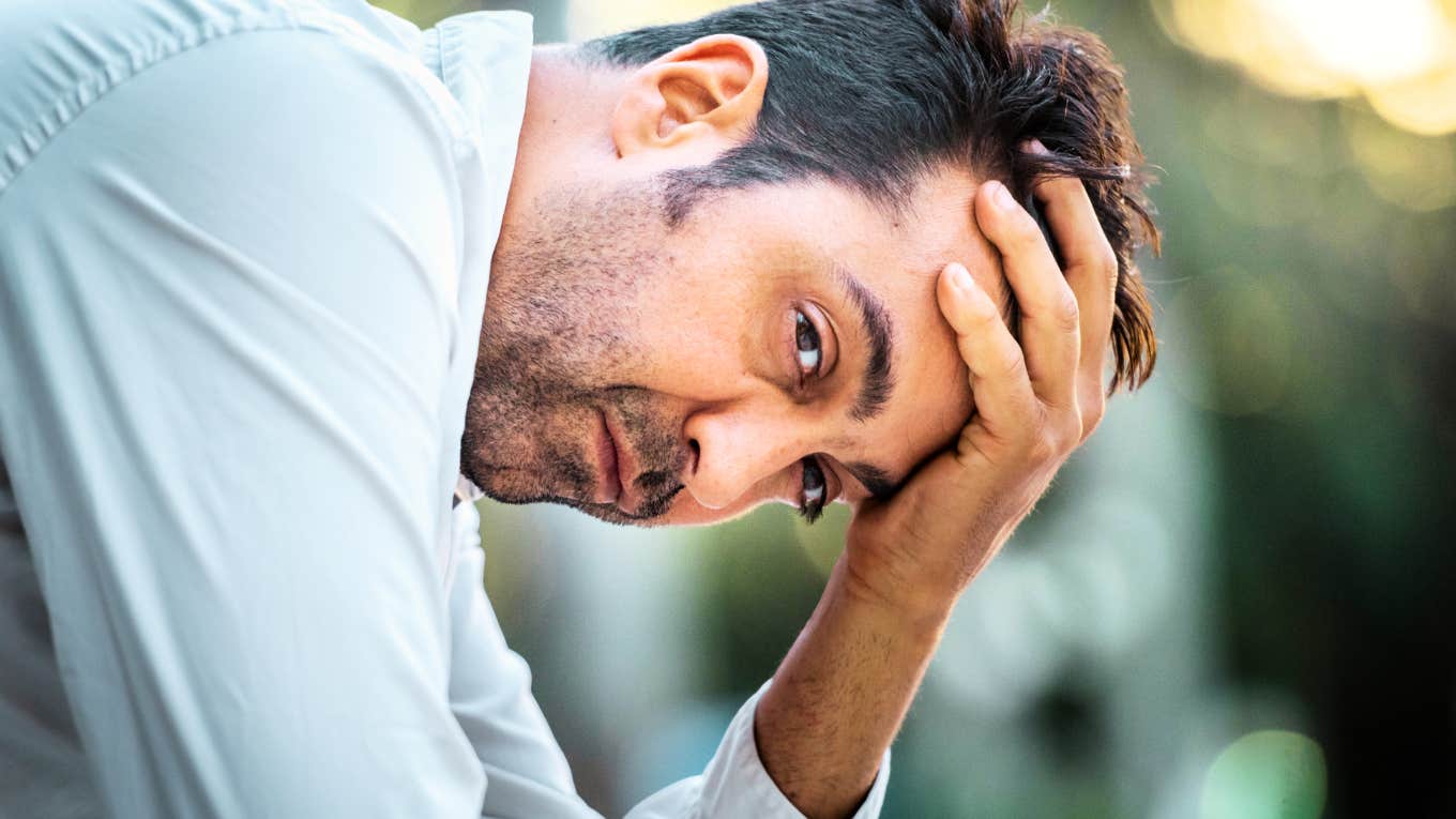 Strange Signs A Marriage Is Quietly Falling Apart, According to Experts Man whose marriage is quietly falling apart.