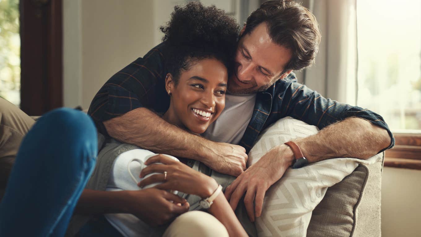 Study Reveals Sad Thing That Happens To People Who Consider Their Partner Their Best Friend couple cuddling on couch