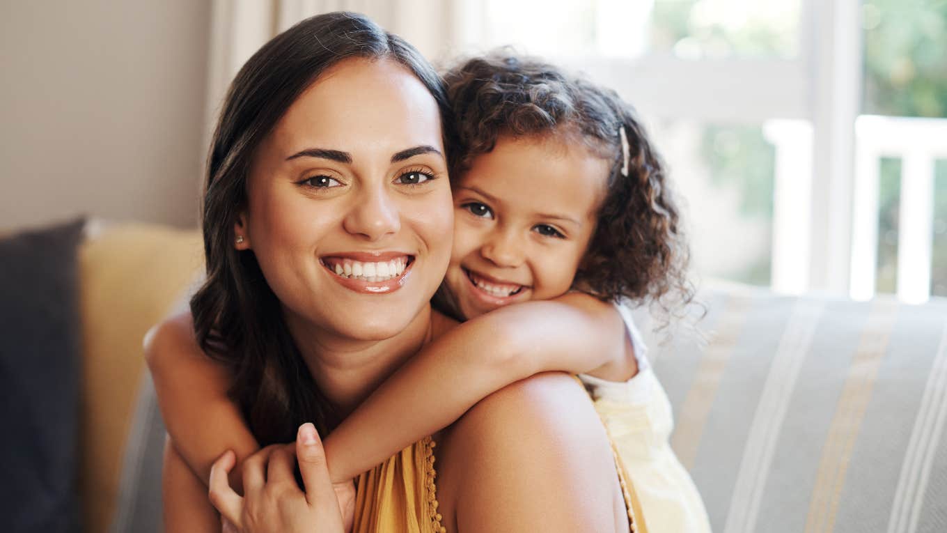 Ways Motherhood Quietly Changes You, No Matter How Old Your Kids Are happy mother holding her young daughter