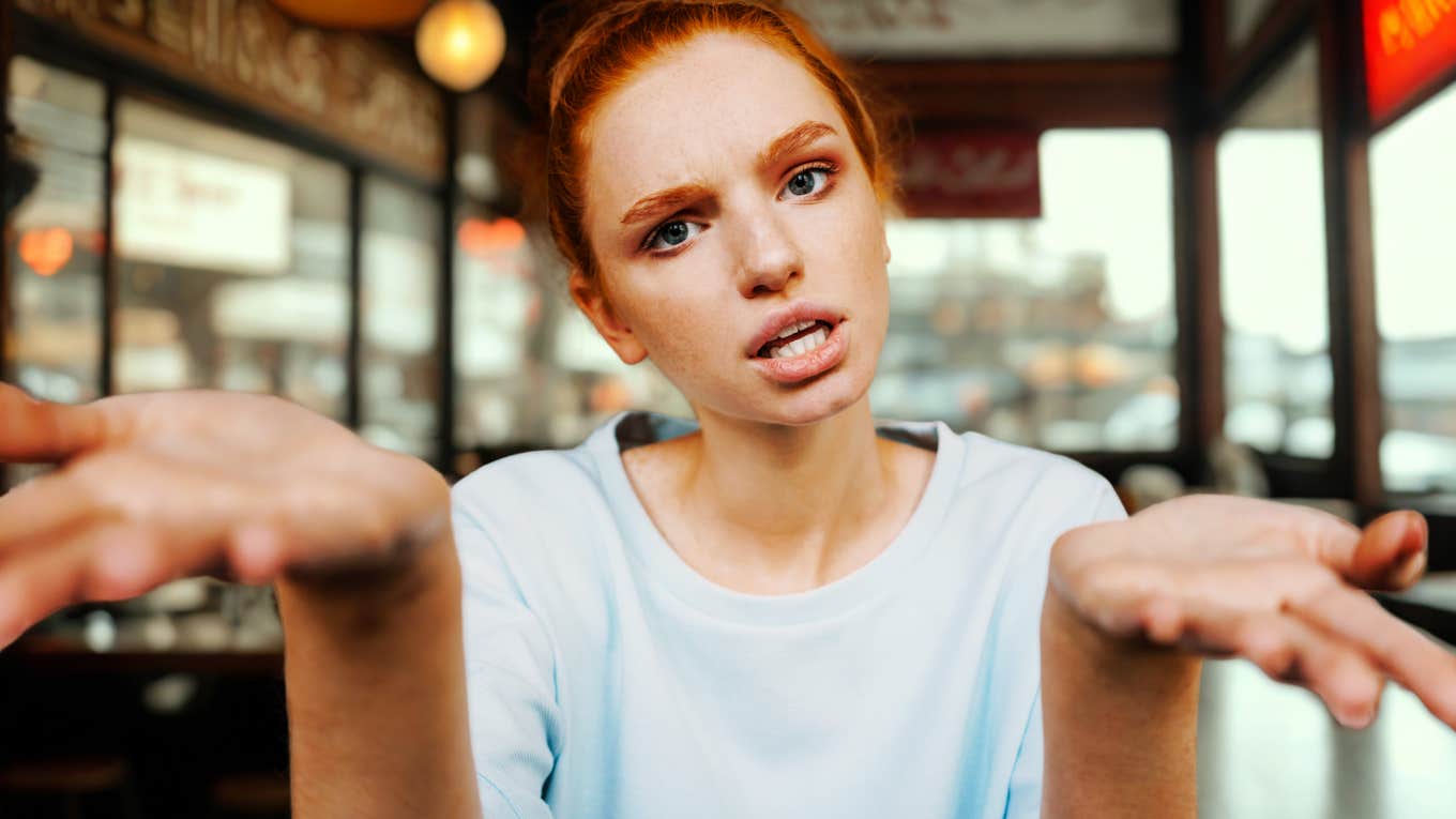 Behaviors That Are Major Signs You Should Urgently Leave A Relationship, According To Experts Woman who is giving man major signs to urgently leave relationship.