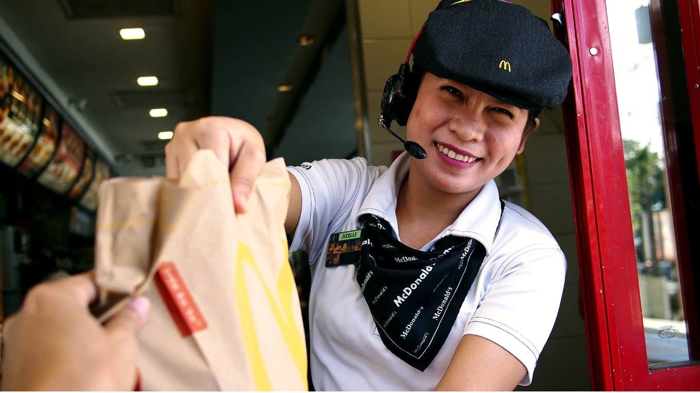 McDonalds worker in the drive-through window. 