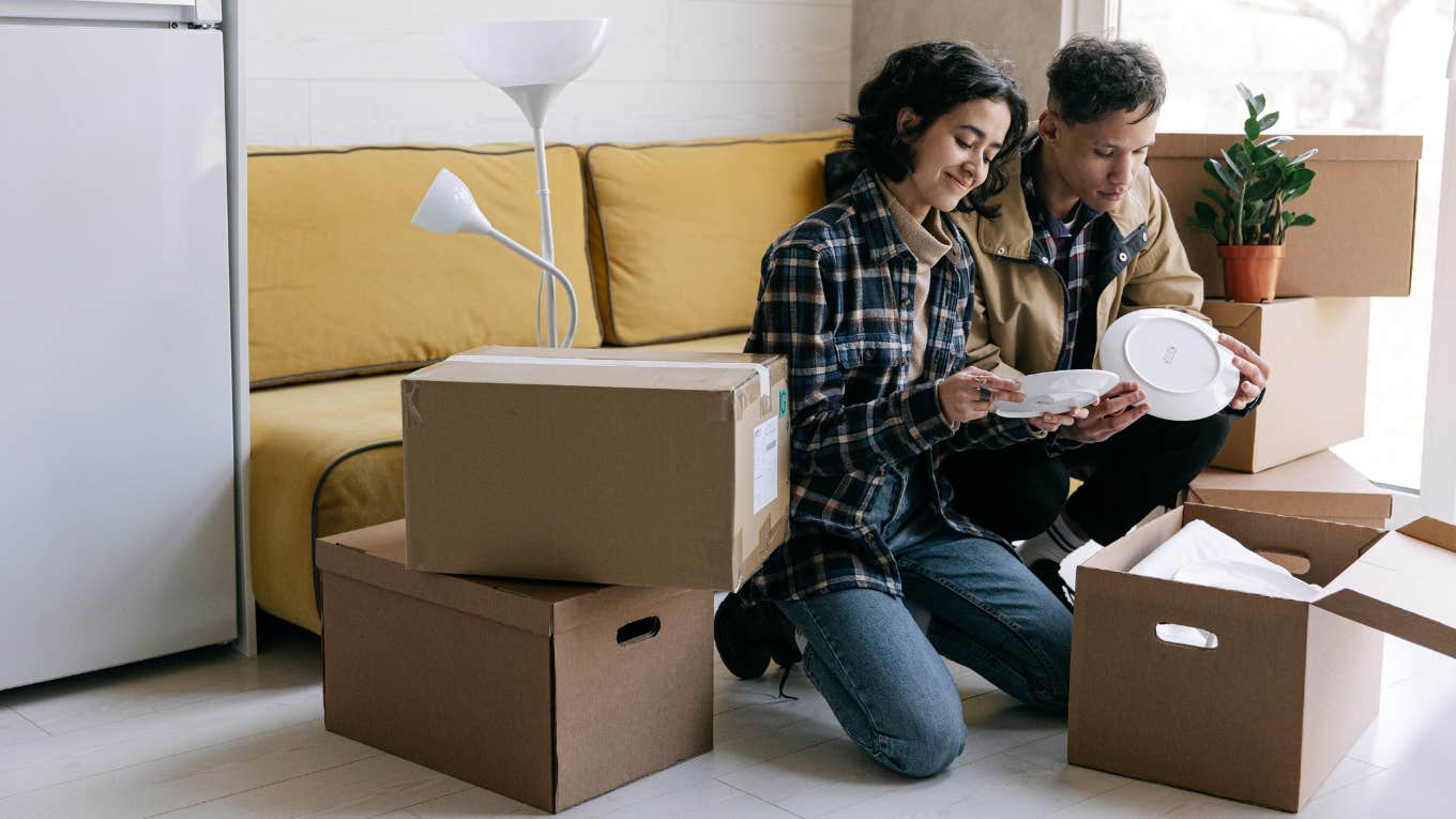 people unpacking moving boxes