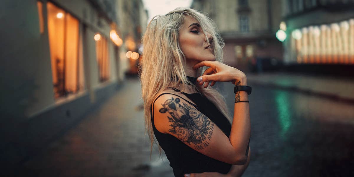 Woman walking with neck tattoo, urban boho fashion and style - a Royalty  Free Stock Photo from Photocase