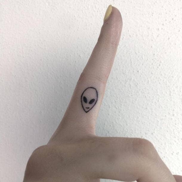 alien head tattoo finger