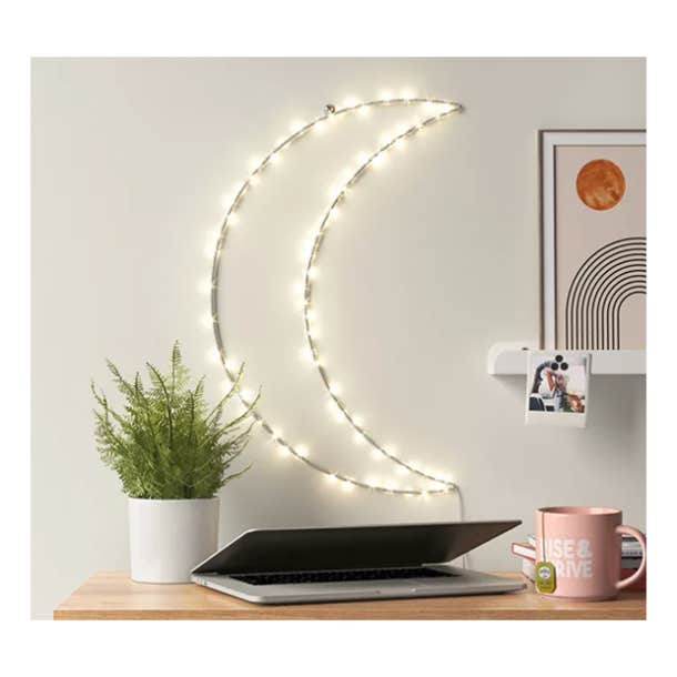 https://www.yourtango.com/sites/default/files/styles/body_image_default/public/2020/white-elephant-gifts-under-50-LED-Light-Up-Wall-Decor-Crescent-Moon.png