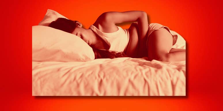 Woman curled in period pain, stage ii endometriosis