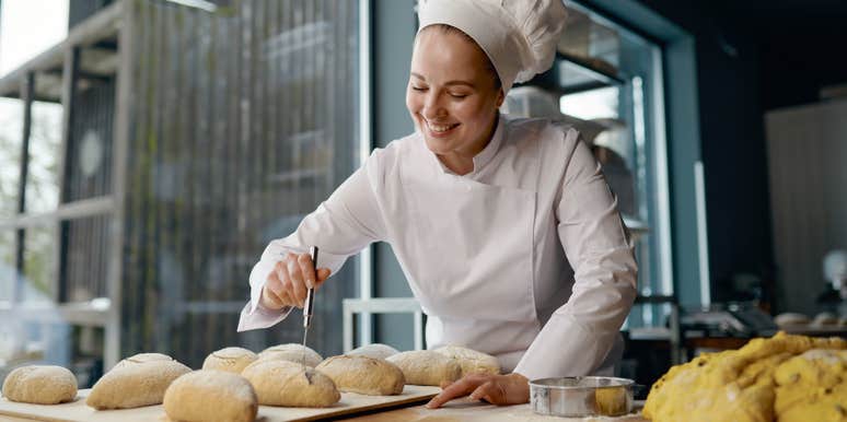 female baker making rolls