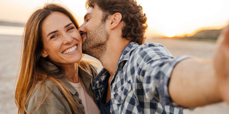 sweet couple man kissing woman cheek