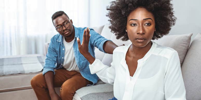 Girlfriend looking upset at her boyfriend for missing rent. 