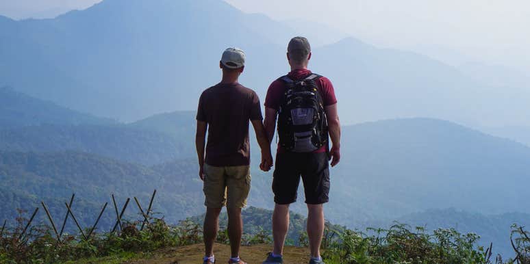 Gay couple on high altitude mountain