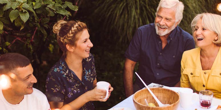 Woman enjoying time with her husband's family.