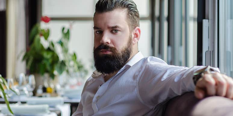 Elder millennial man sitting in a restaurant