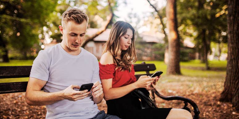 Couple ignoring each other, on their phones.