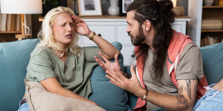 Young married couple husband and wife sitting at home having problems in their marriage