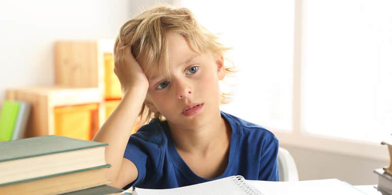 First-grade boy struggling with homework