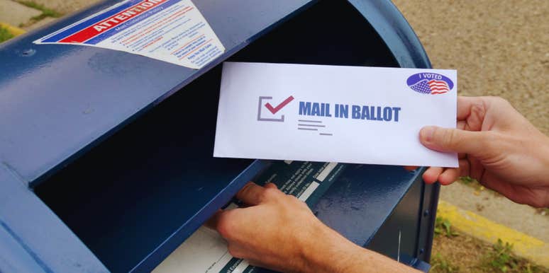 man casting mail-in vote 