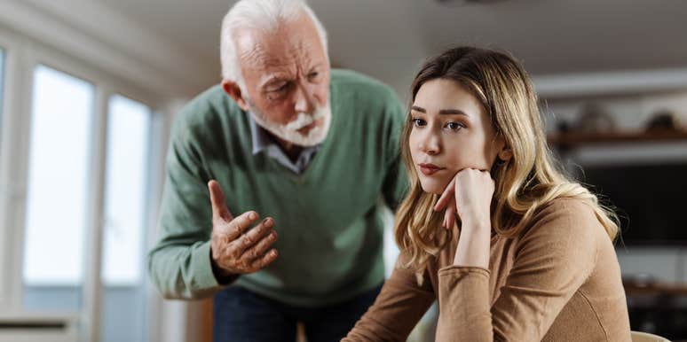 older father lecturing daughter