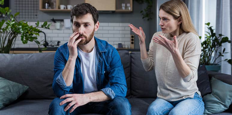 woman upset at man sitting silently