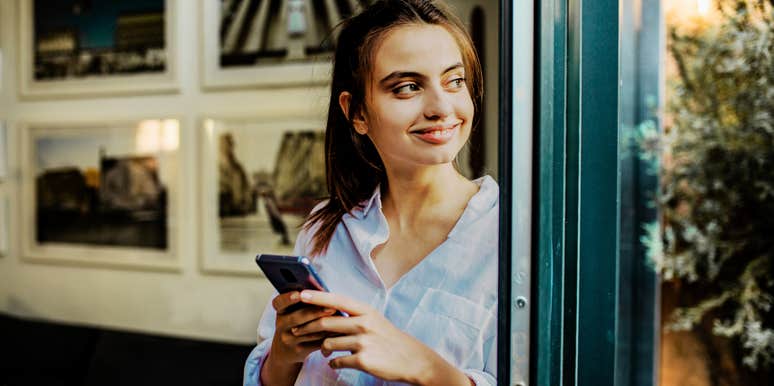 Woman texting a guy online, and being asked out.