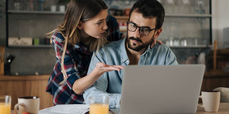 Man and woman looking at their spending