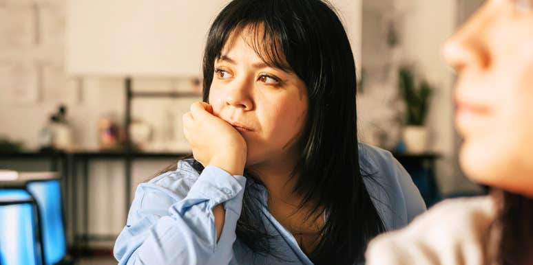 Gen-Z student zoning out anxiously while in class.