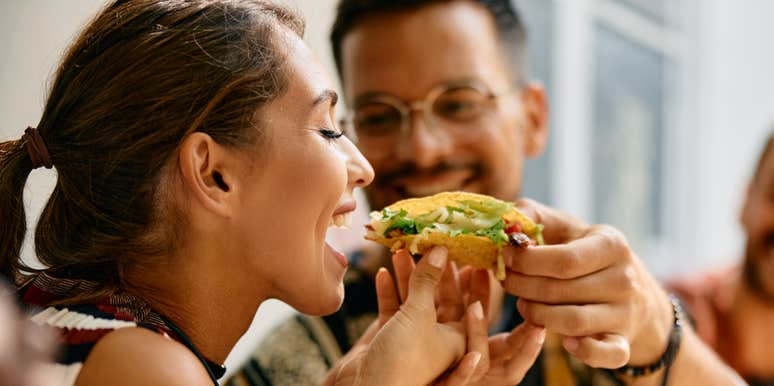 Couple eating tacos on a date