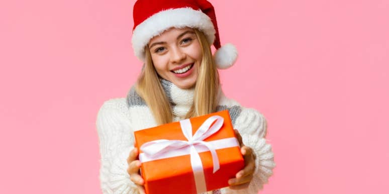 woman holding christmas gift 