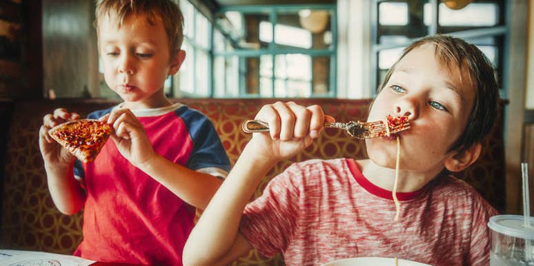 American children eating unhealthy meals at a restaurant