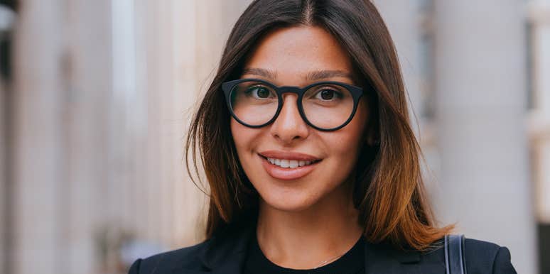 smiling happy businesswoman wearing black