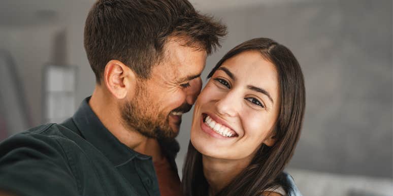 Happy couple smiling and hugging