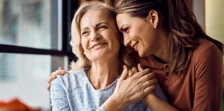 adult daughter hugging her mom