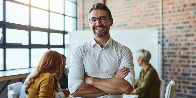 CEO smiling in meeting room