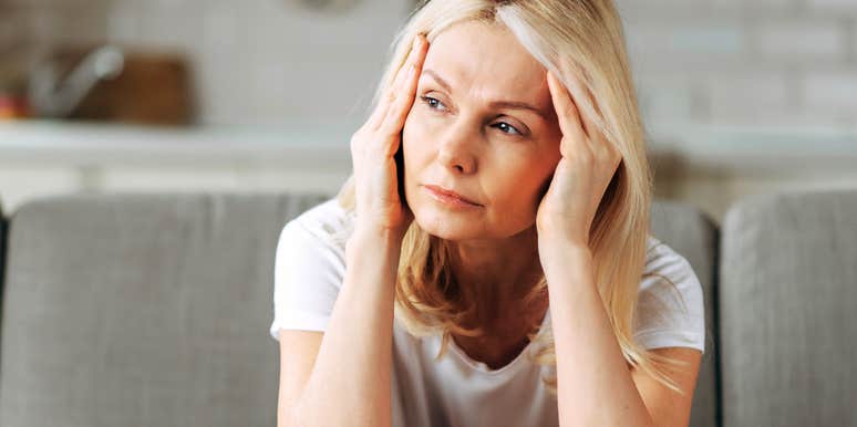 Woman with no enthusiasm thinking of friend's upcoming wedding. 