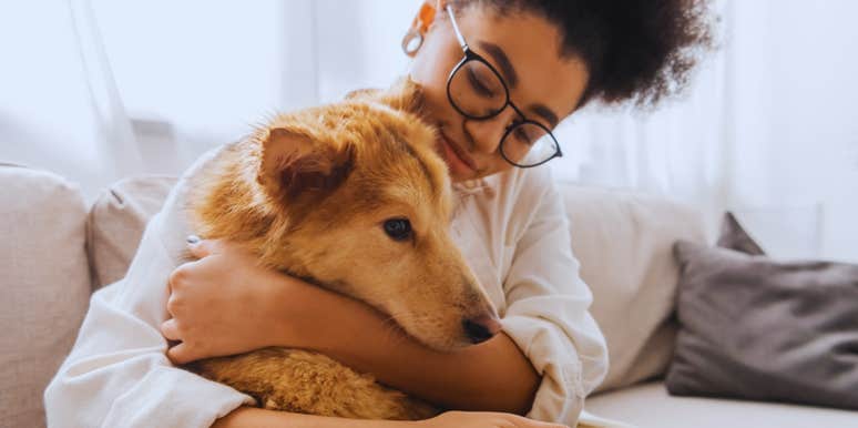 woman hugging dog 