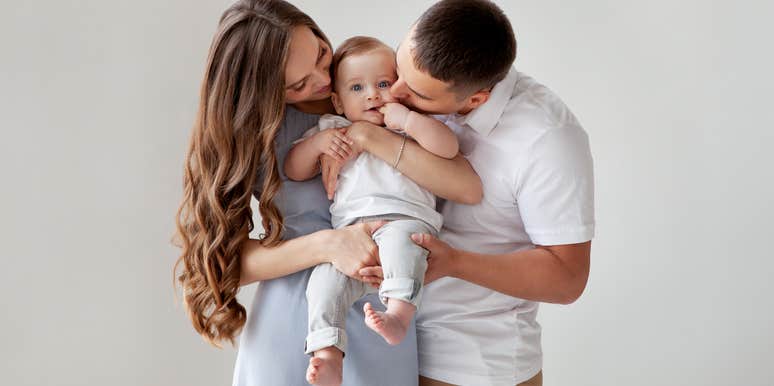 Parents holding baby