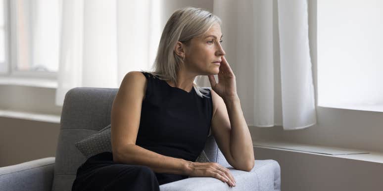 worried mom looking out window