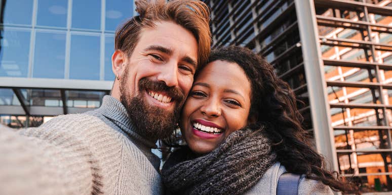 Young man and woman tourist making selfie and smile to the camera.