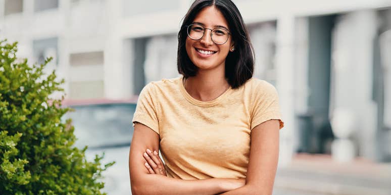 Smart woman standing confidently outside. 