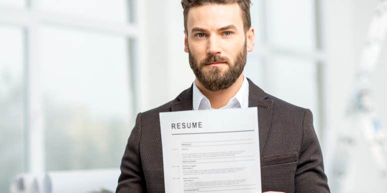 Job applicant holding a copy of his resume