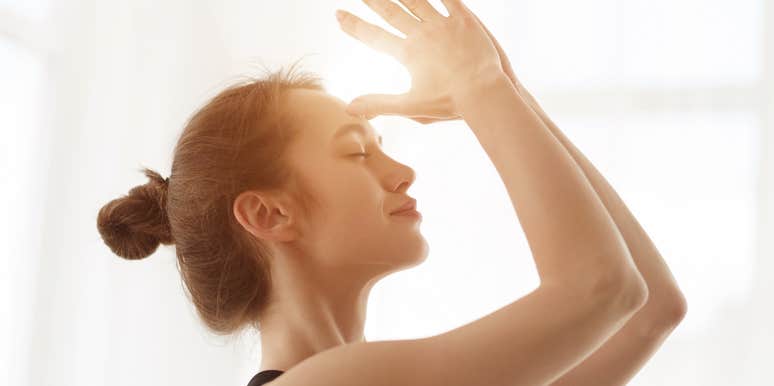 Woman touching her third eye 