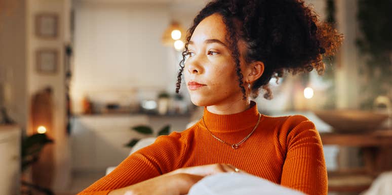 Woman only pretending to be happy in relationship.