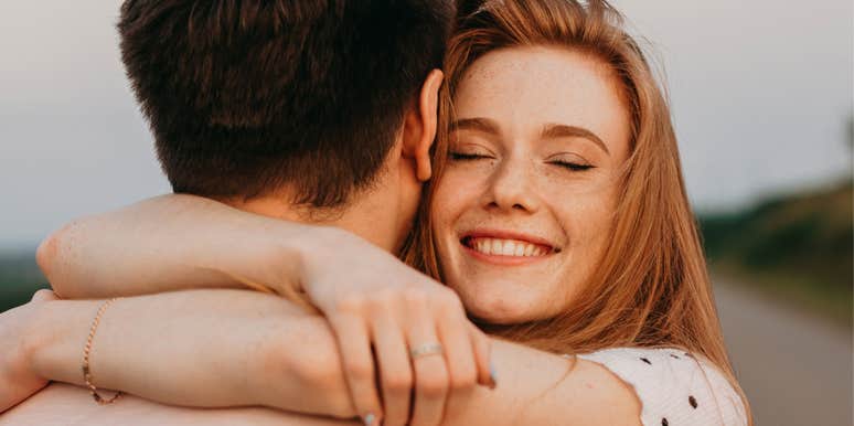 Woman hugging man after giving him a valentine's day surprise