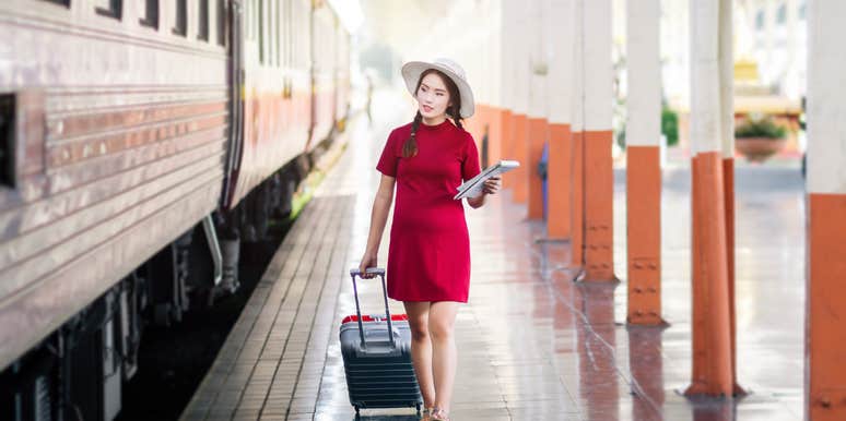 Pregnant woman about to take seat a train passenger specifically paid for