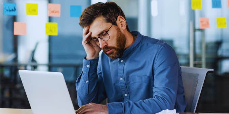 man stressed at toxic job 