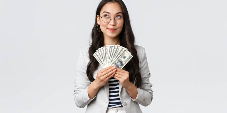 financially responsible woman holding cash