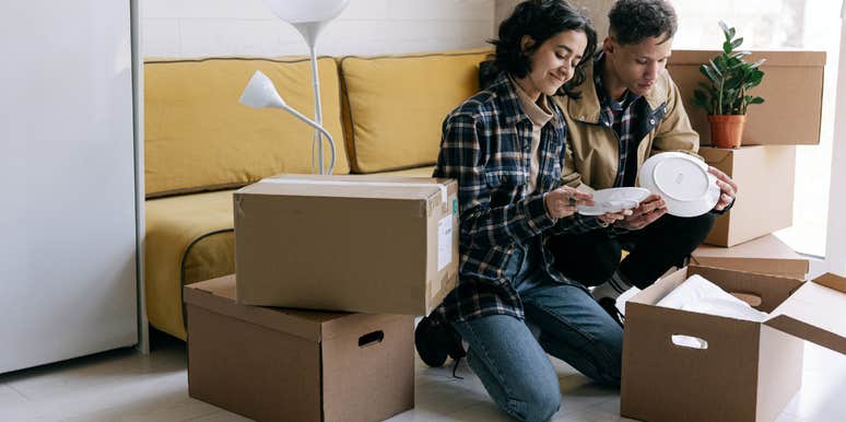 people unpacking moving boxes