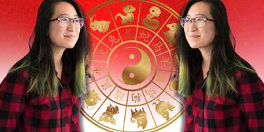 woman next to chinese zodiac wheel