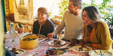 family having fun eating together during home dinner 