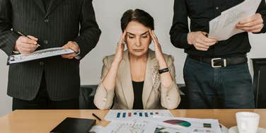 Woman stressed out at corporate job