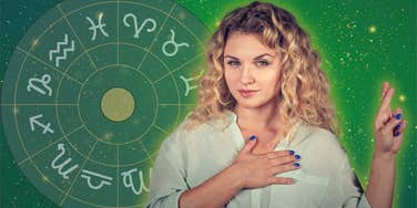 lying woman with fingers crossed on zodiac background